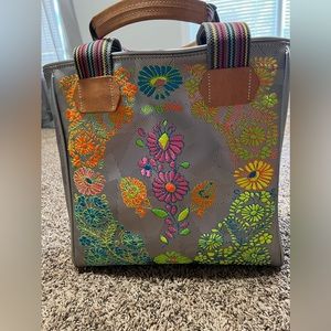 Kylie metallic classic consuela tote.